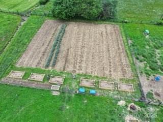 718 Bald Mountain Road Burnsville, NC 28714 - Photo 35 of 37 a backyard of a house with lots of green space