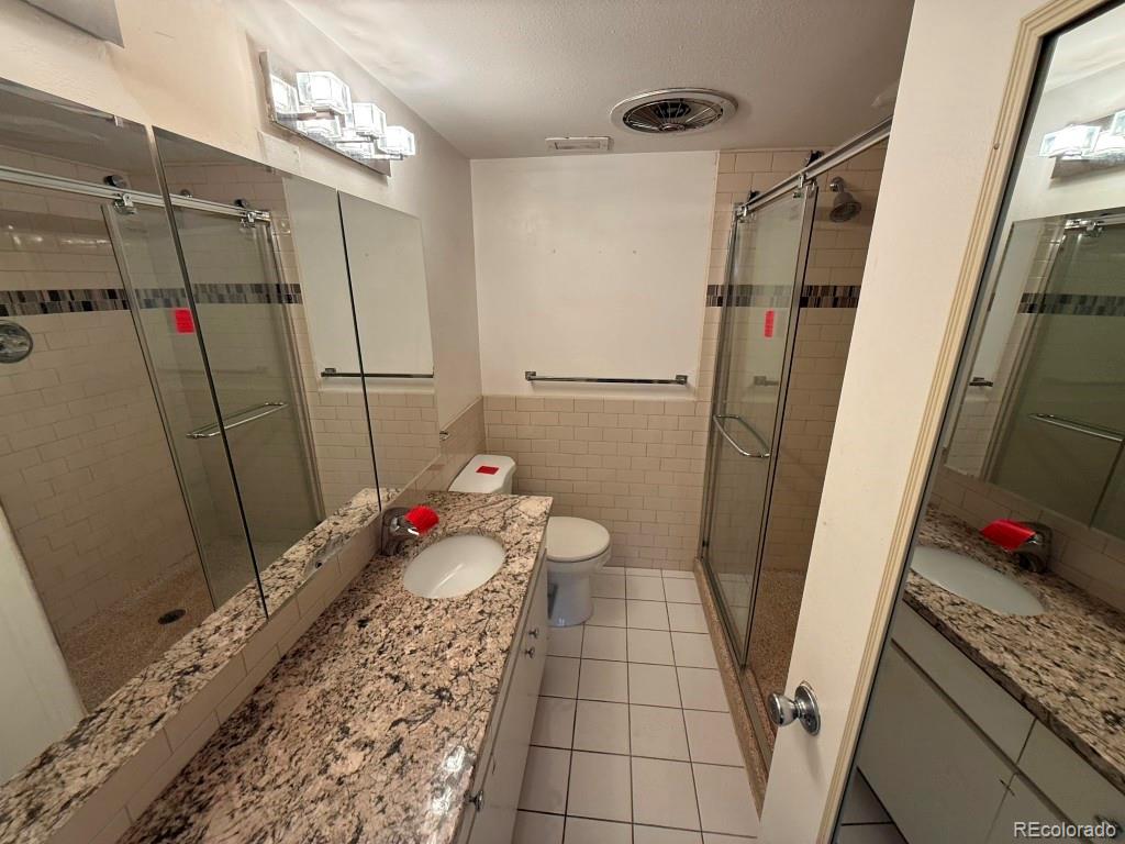 888 Logan Street, Unit 5H Denver, CO 80203 - Photo 12 of 25 a bathroom with a sink and a shower