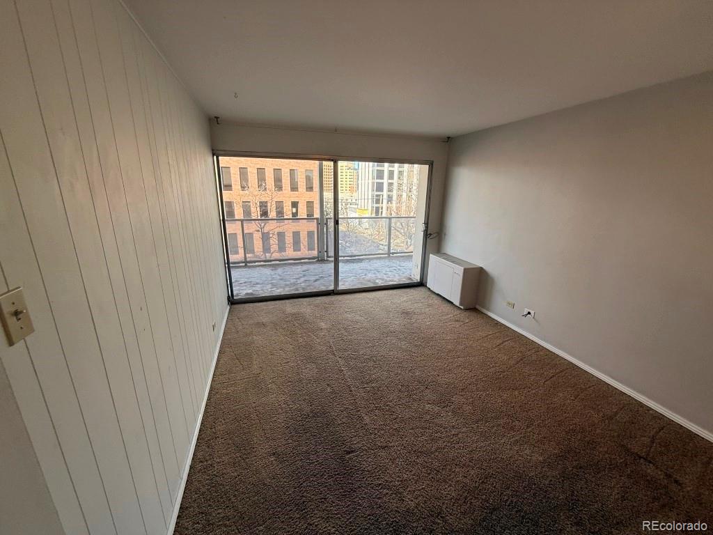 888 Logan Street, Unit 5H Denver, CO 80203 - Photo 13 of 25 a view of an empty room with a window
