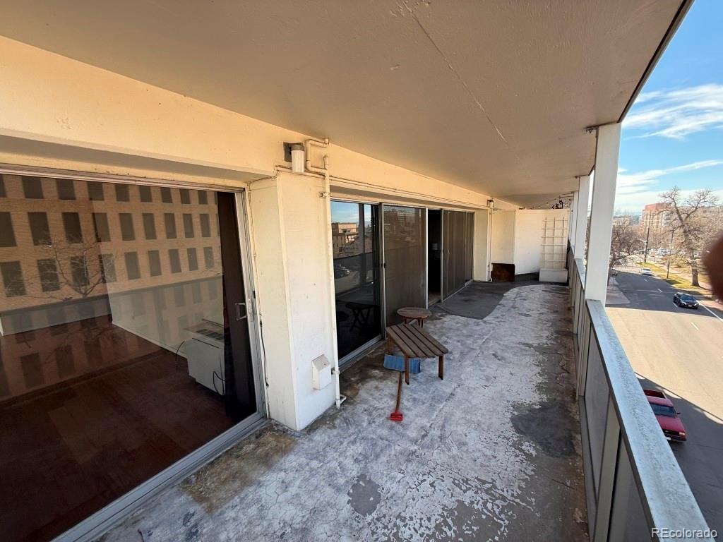 888 Logan Street, Unit 5H Denver, CO 80203 - Photo 17 of 25 a view of entryway with wooden floor and a rug