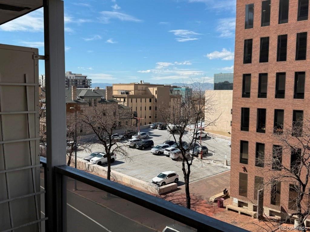 888 Logan Street, Unit 5H Denver, CO 80203 - Photo 18 of 25 a view of a city from a balcony