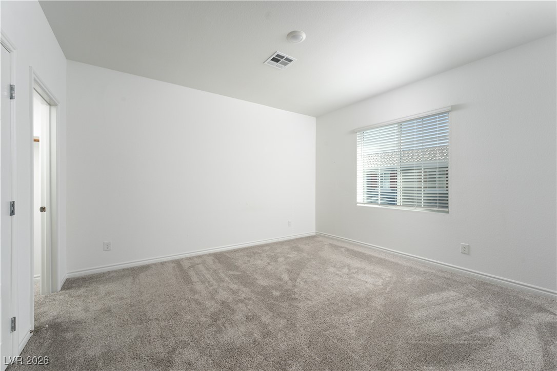 7330 North Decatur Boulevard, Unit 1 North Las Vegas, NV 89084 - Photo 16 of 29 Carpeted spare room with baseboards