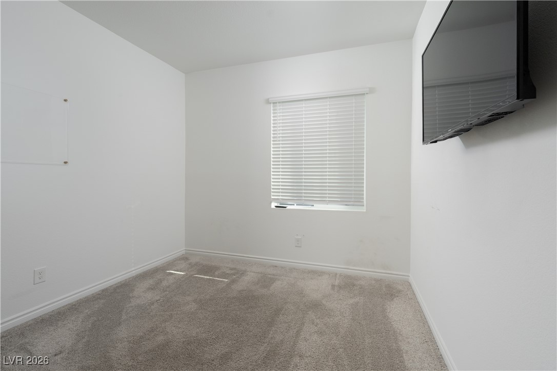7330 North Decatur Boulevard, Unit 1 North Las Vegas, NV 89084 - Photo 19 of 29 Carpeted spare room with baseboards