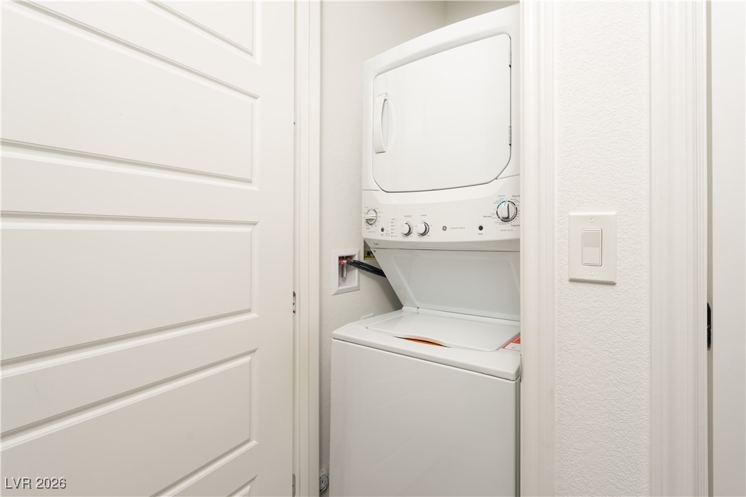 7330 North Decatur Boulevard, Unit 1 North Las Vegas, NV 89084 - Photo 22 of 29 Laundry area with stacked washer / drying machine