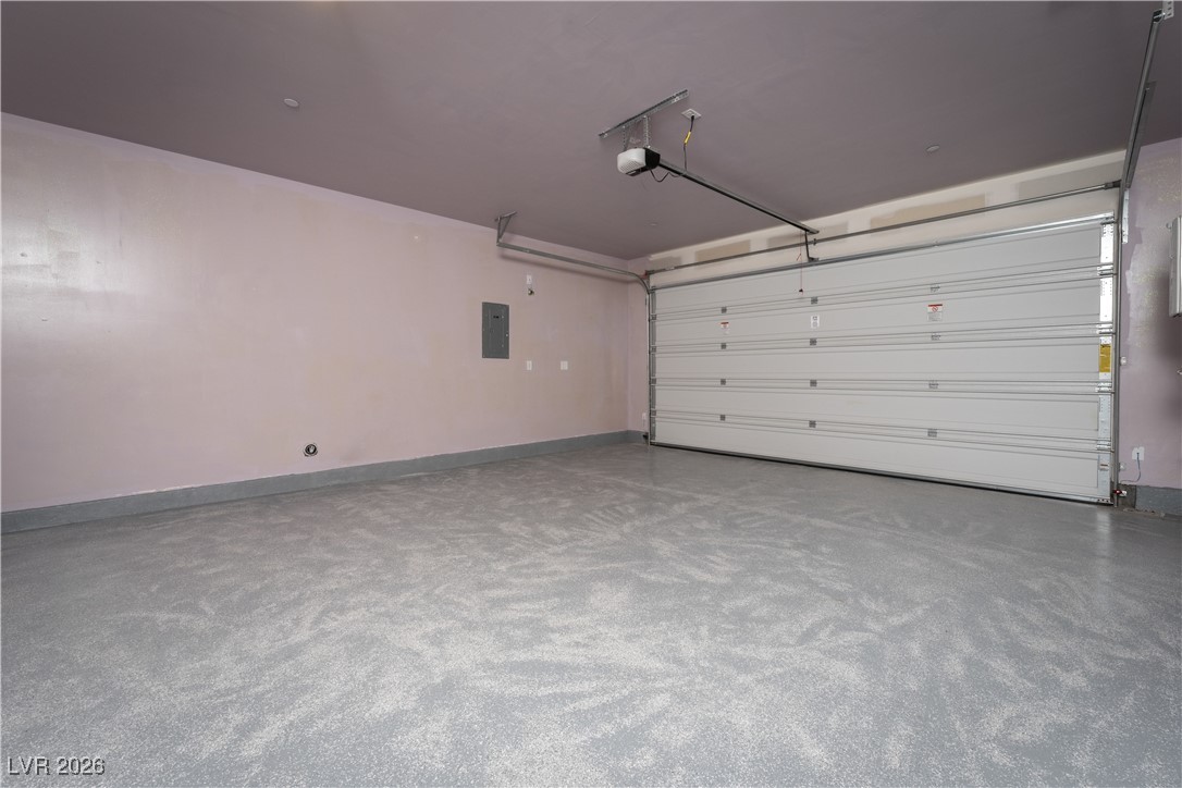 7330 North Decatur Boulevard, Unit 1 North Las Vegas, NV 89084 - Photo 27 of 29 Garage with baseboards and electric panel
