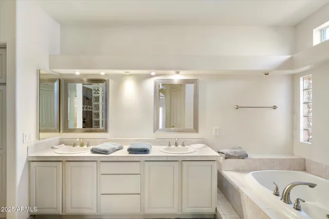 a spacious bedroom with a bed and a couch