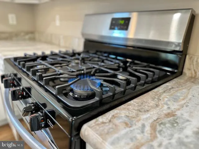 a close up of a stove top oven sitting inside of a kitchen