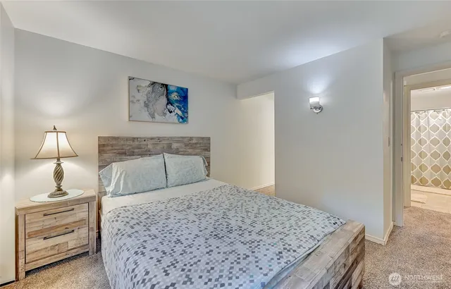 a bedroom with a bed and a couch