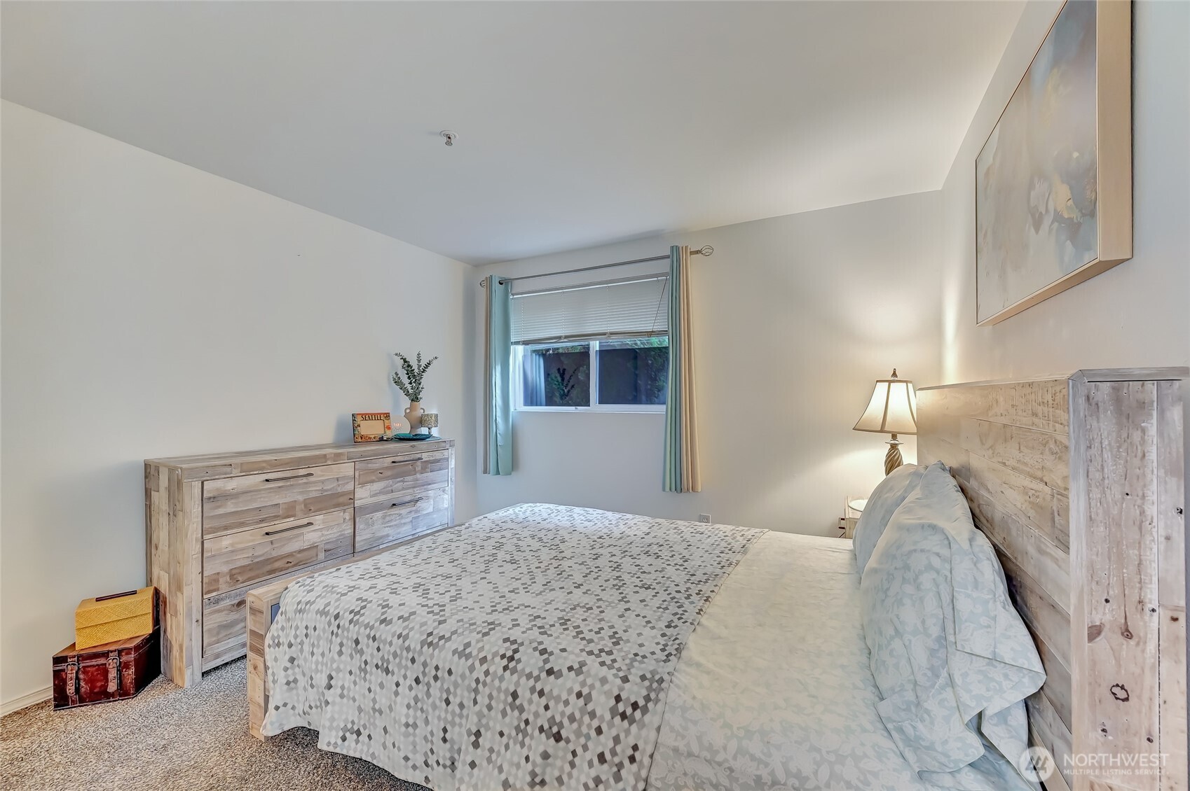 5000 Lake Washington Boulevard Northeast, Unit F105 Renton, WA 98056 - Photo 15 of 27 a bedroom with a bed and a couch