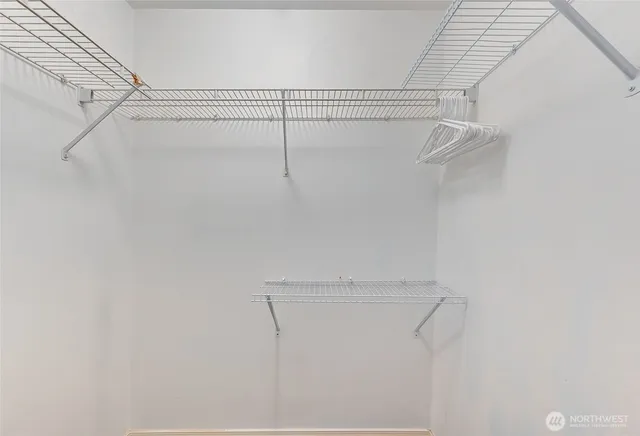 a bathroom with a sink vanity mirror and tub