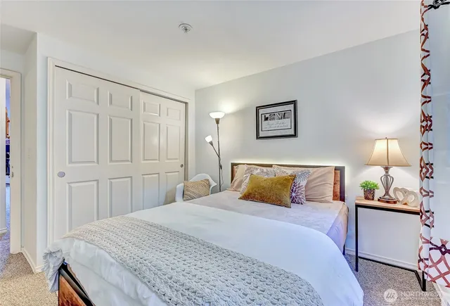 a bathroom with a sink toilet and a mirror