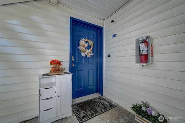 a view of an entryway with wooden floor