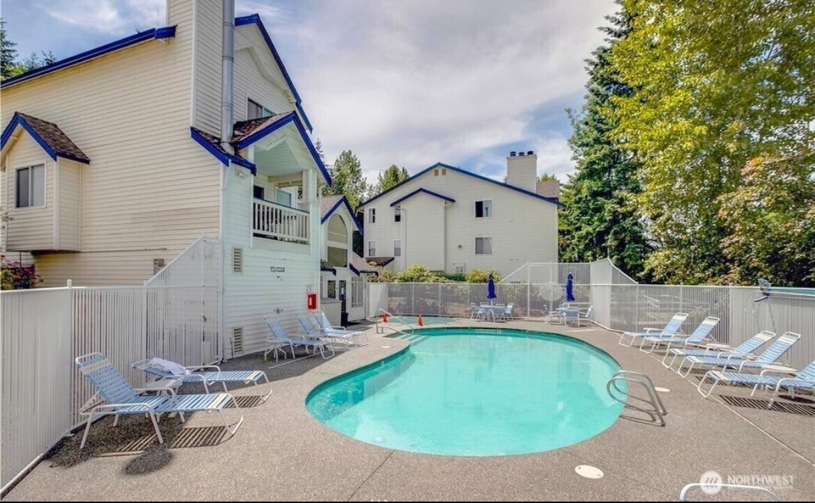 5000 Lake Washington Boulevard Northeast, Unit F105 Renton, WA 98056 - Photo 26 of 27 a view of a house with backyard sitting area and furniture