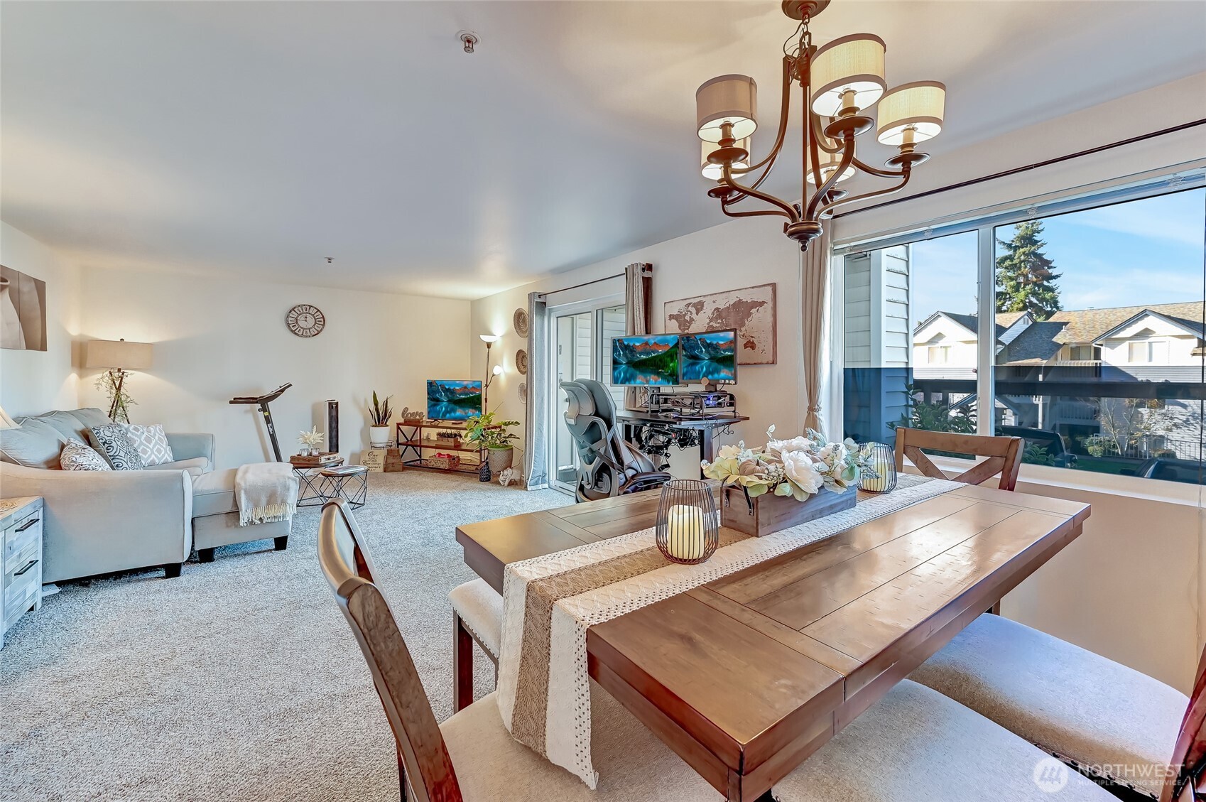 5000 Lake Washington Boulevard Northeast, Unit F105 Renton, WA 98056 - Photo 6 of 27 a view of a dining room with furniture a chandelier windows and wooden floor