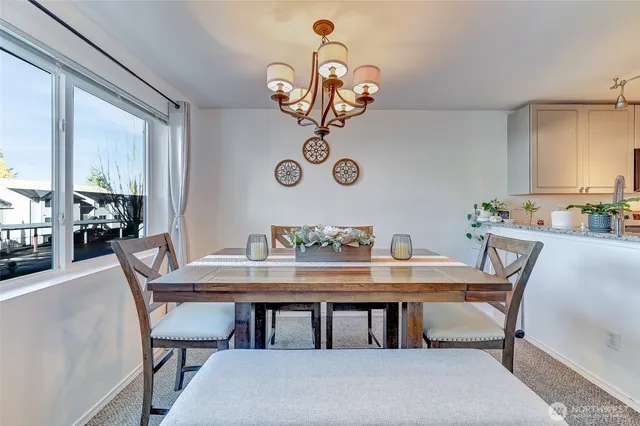 a kitchen with stainless steel appliances granite countertop a sink a stove and a microwave