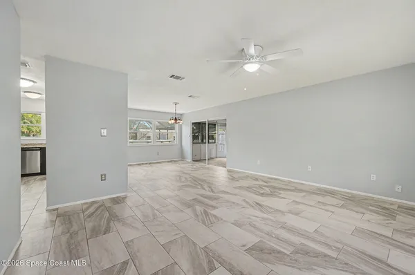 a kitchen with stainless steel appliances kitchen island granite countertop a sink and cabinets