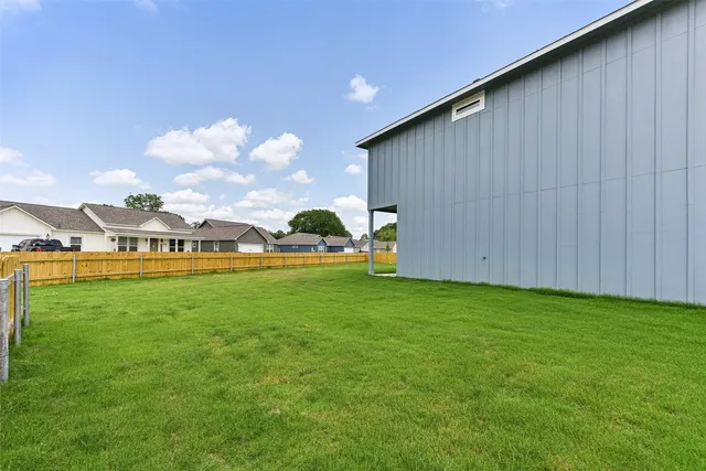 a view of yard with outdoor seating and green space