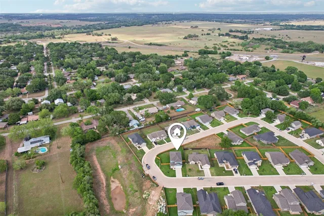 an aerial view of beach and residential space