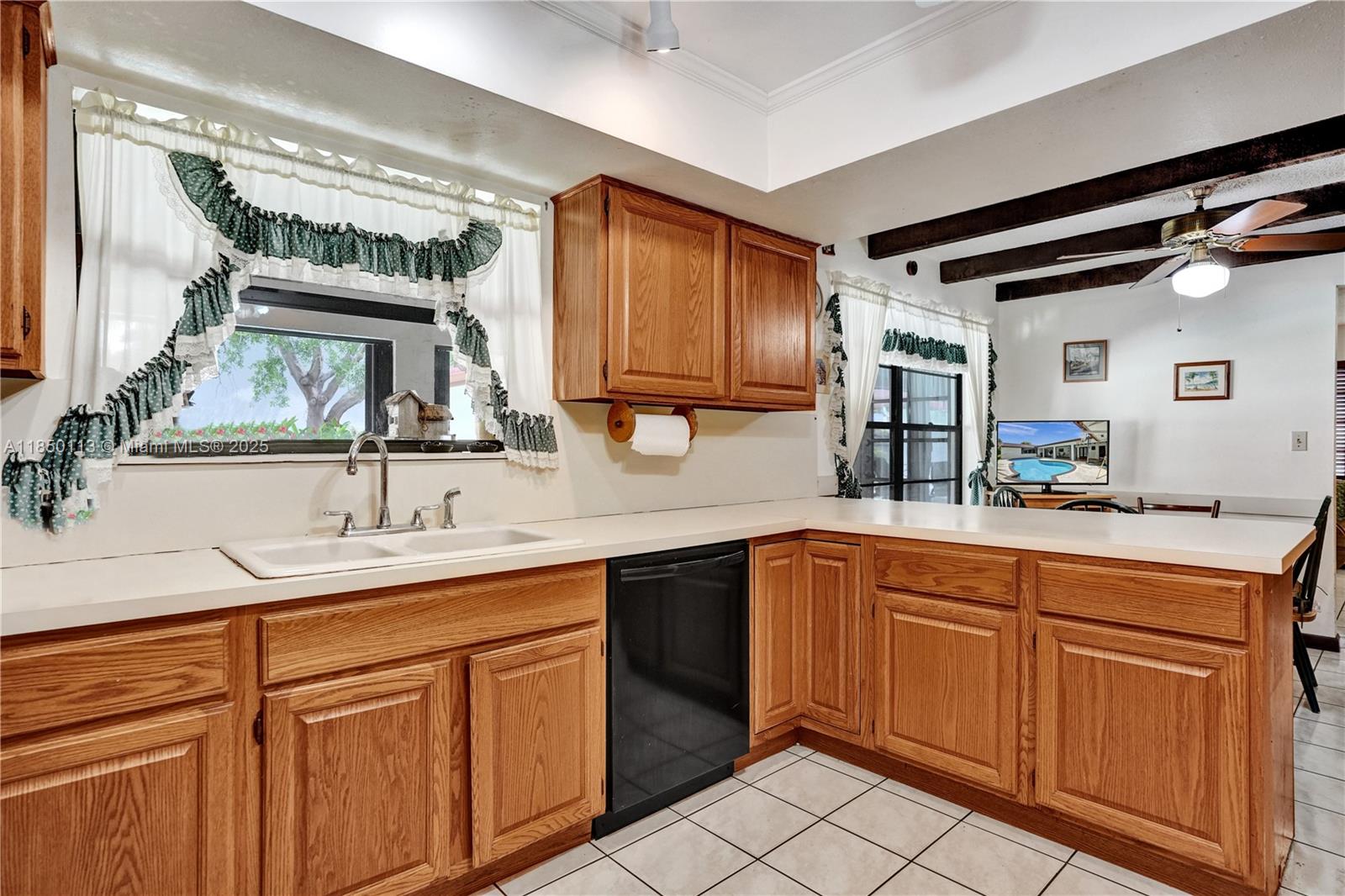 9461 Southwest 134th Street Miami, FL 33176 - Photo 13 of 33 a kitchen with a sink and cabinets