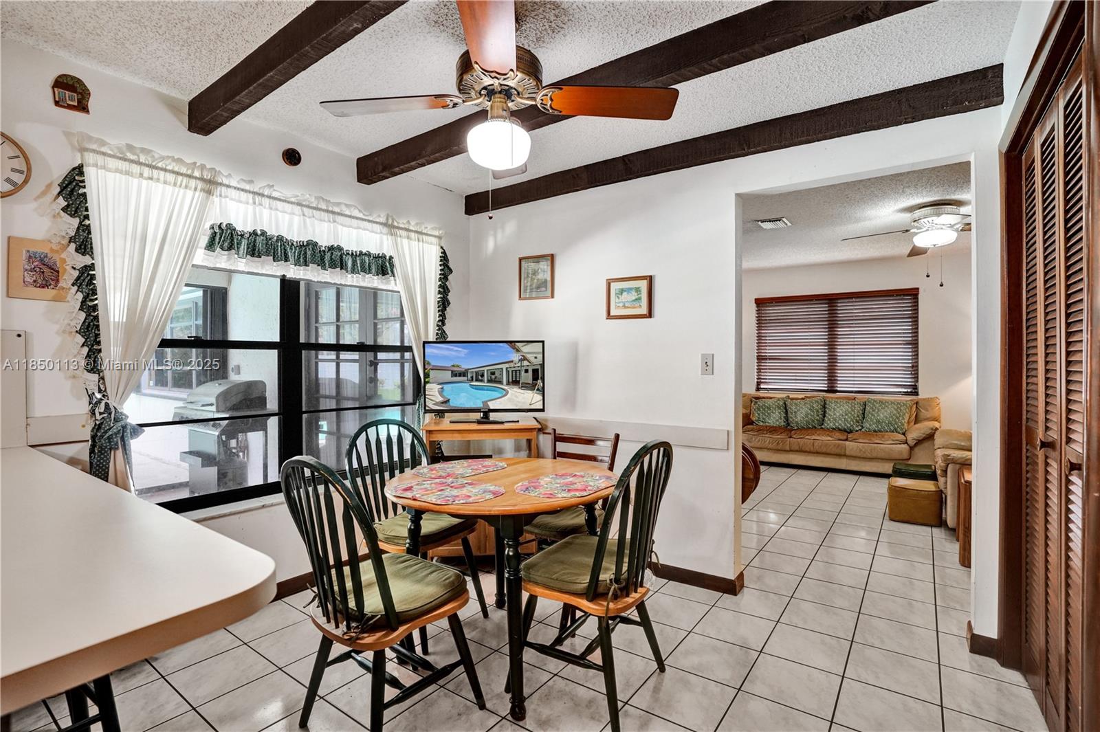 9461 Southwest 134th Street Miami, FL 33176 - Photo 15 of 33 a dining room with furniture and window