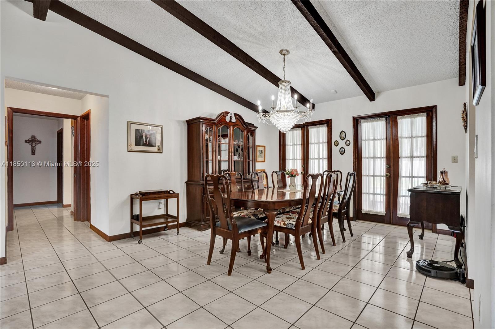 9461 Southwest 134th Street Miami, FL 33176 - Photo 16 of 33 a view of a dining room with furniture