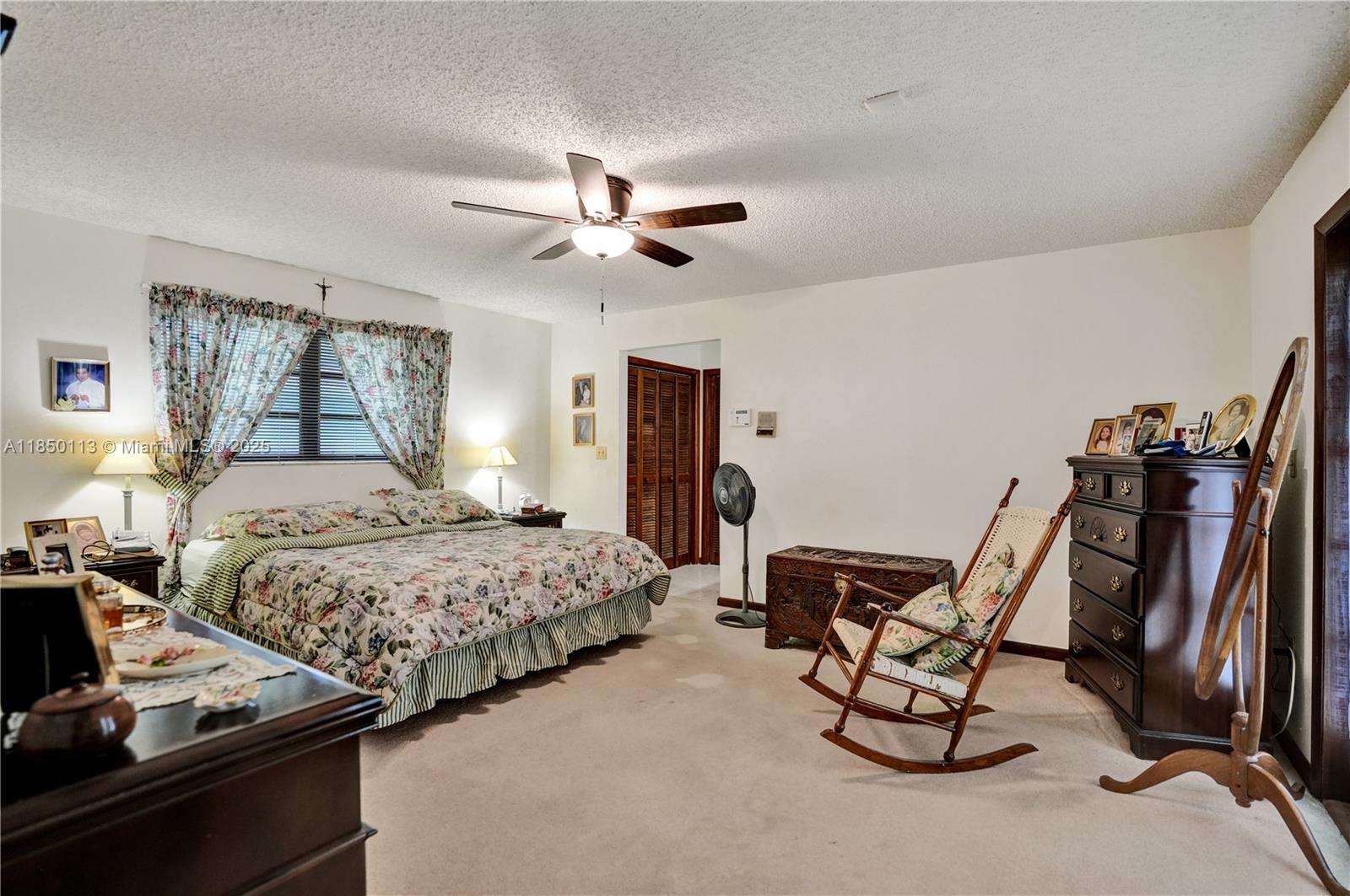 9461 Southwest 134th Street Miami, FL 33176 - Photo 17 of 33 a bedroom with bed and window