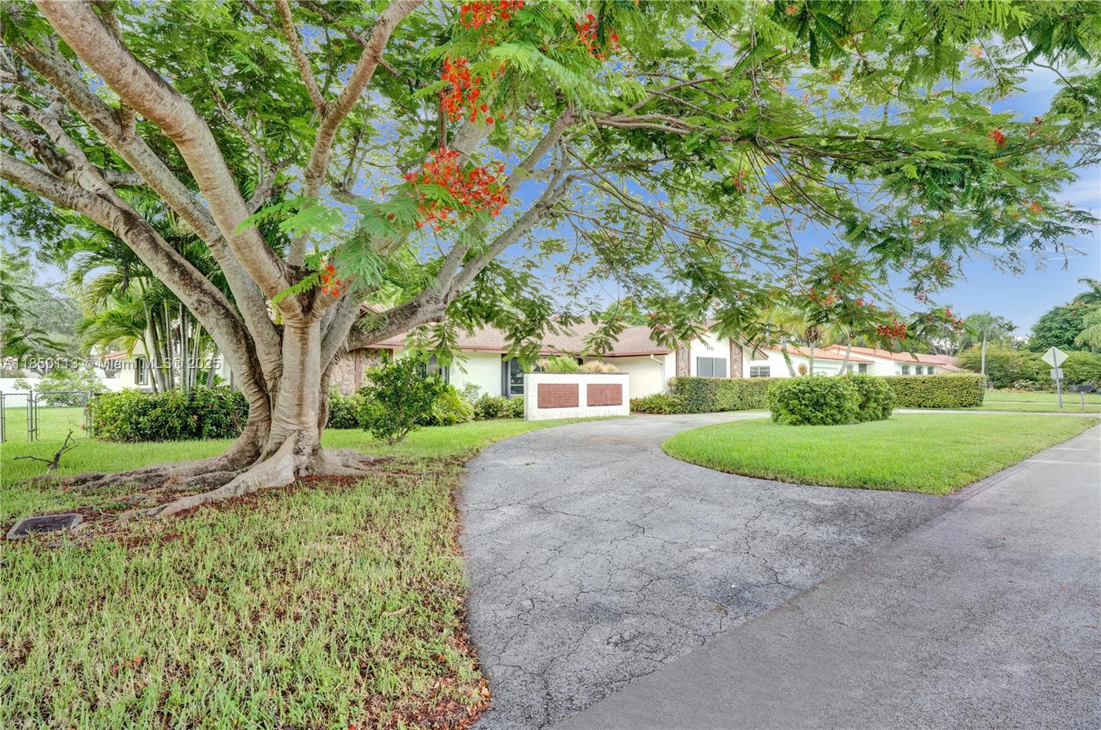9461 Southwest 134th Street Miami, FL 33176 - Photo 2 of 33 a view of a garden with trees
