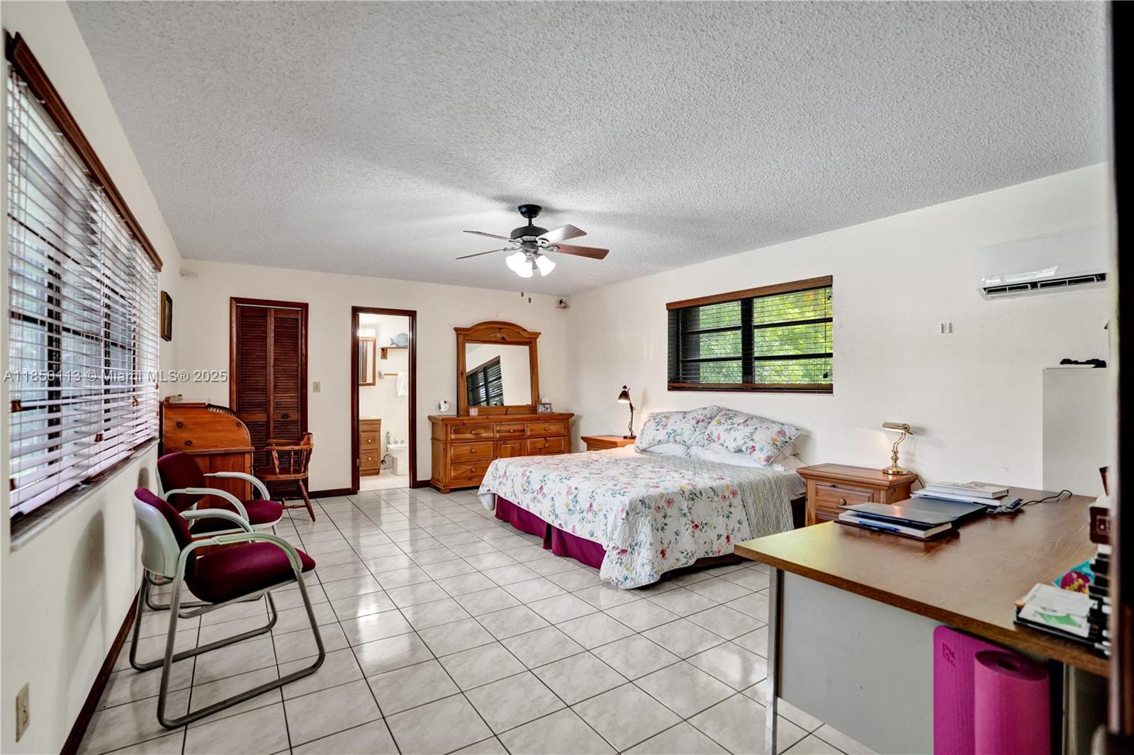 9461 Southwest 134th Street Miami, FL 33176 - Photo 21 of 33 a bedroom with two beds and a couch