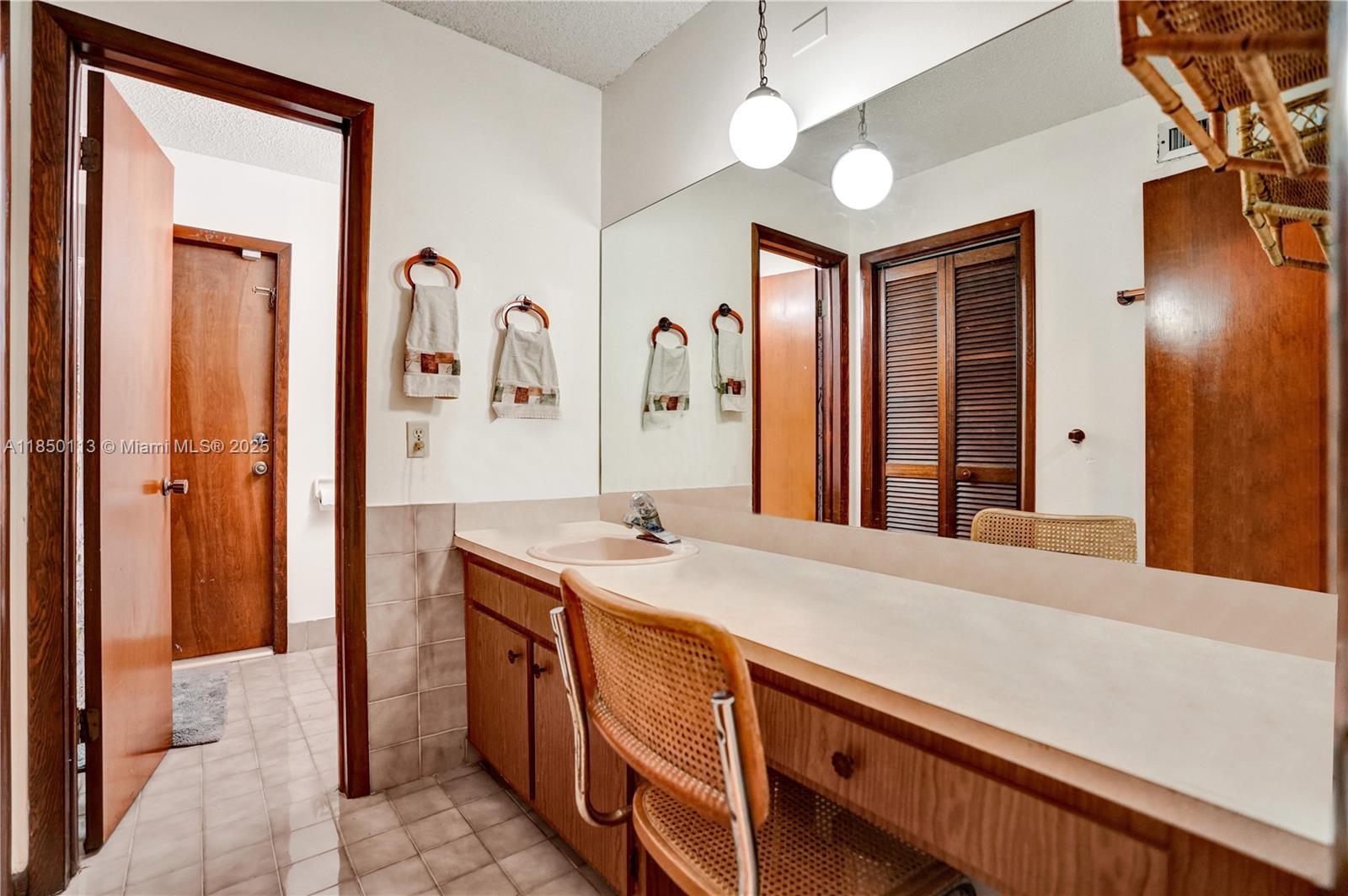 9461 Southwest 134th Street Miami, FL 33176 - Photo 28 of 33 a spacious bathroom with a sink a mirror and a shower
