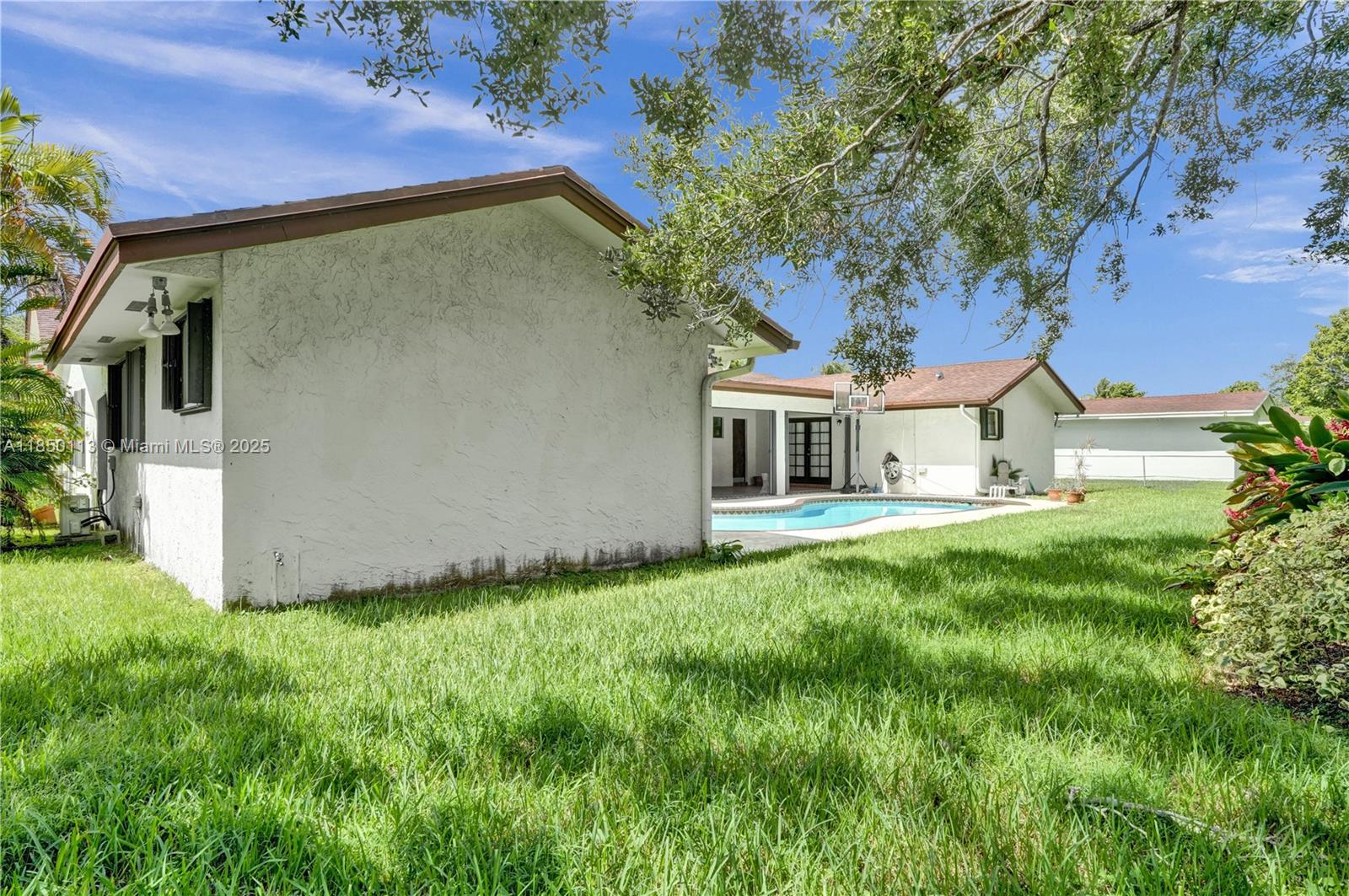 9461 Southwest 134th Street Miami, FL 33176 - Photo 30 of 33 a view of a house with backyard