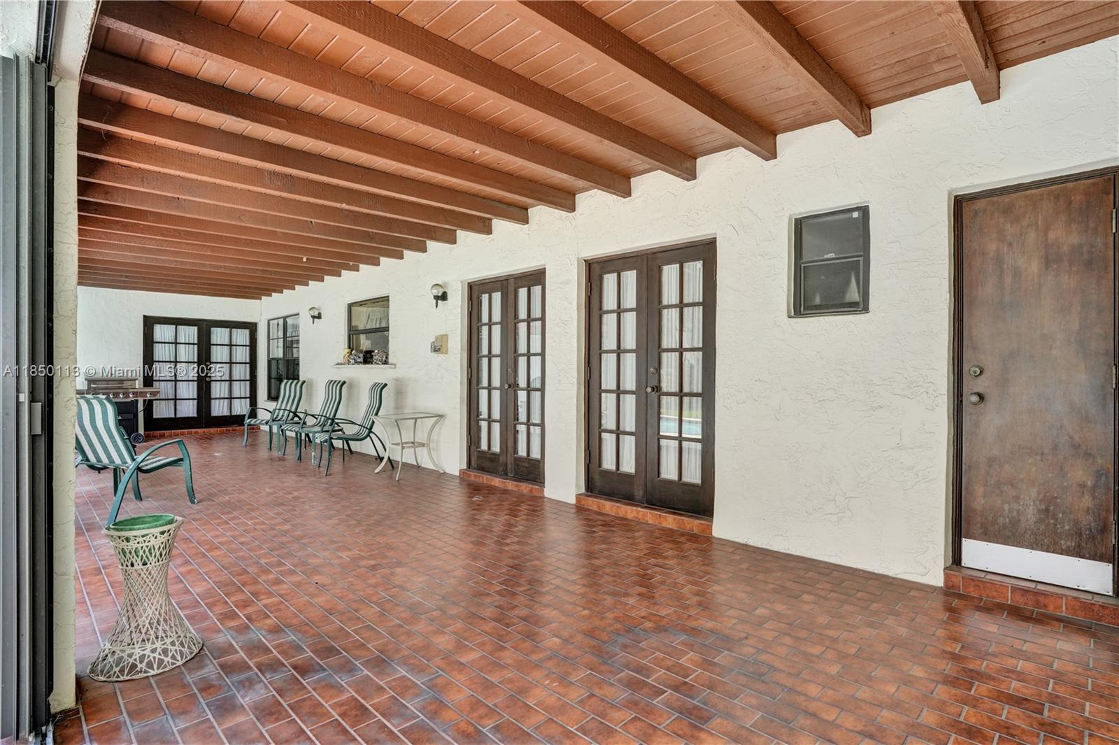 9461 Southwest 134th Street Miami, FL 33176 - Photo 5 of 33 a view of livingroom with furniture and floor to ceiling window