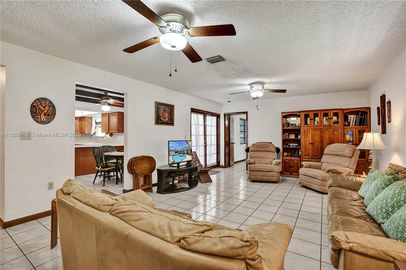9461 Southwest 134th Street Miami, FL 33176 - Photo 9 of 33 a living room with furniture and wooden floor