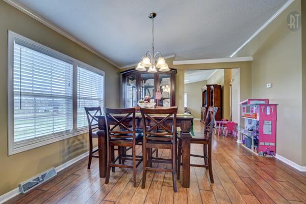 4339 South Garrett Road Springfield, TN 37172 - Photo 11 of 28 a view of a dining room with furniture window and wooden floor