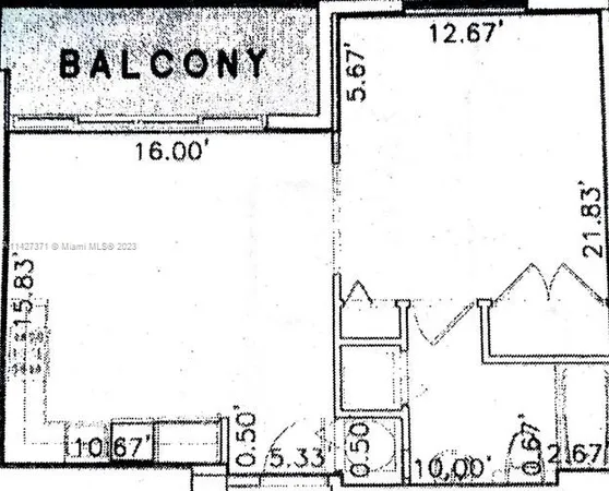 an empty room with sliding glass door and shower