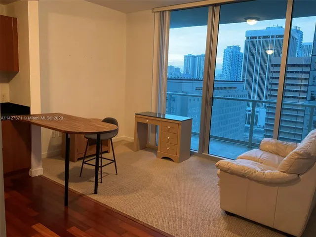a livingroom with furniture and wooden floor
