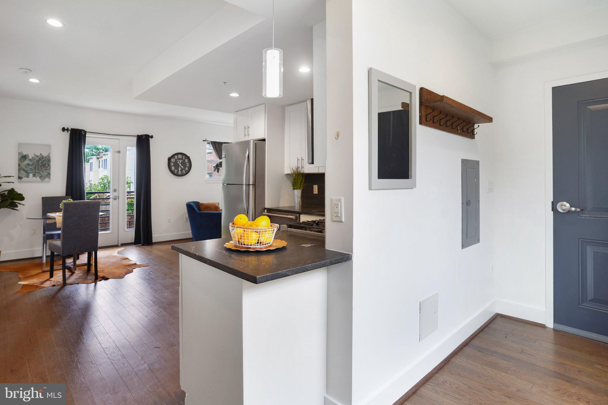 7723 Alaska Avenue Northwest, Unit 103 Washington, DC 20012 - Photo 11 of 12 Modern kitchen with inviting layout.