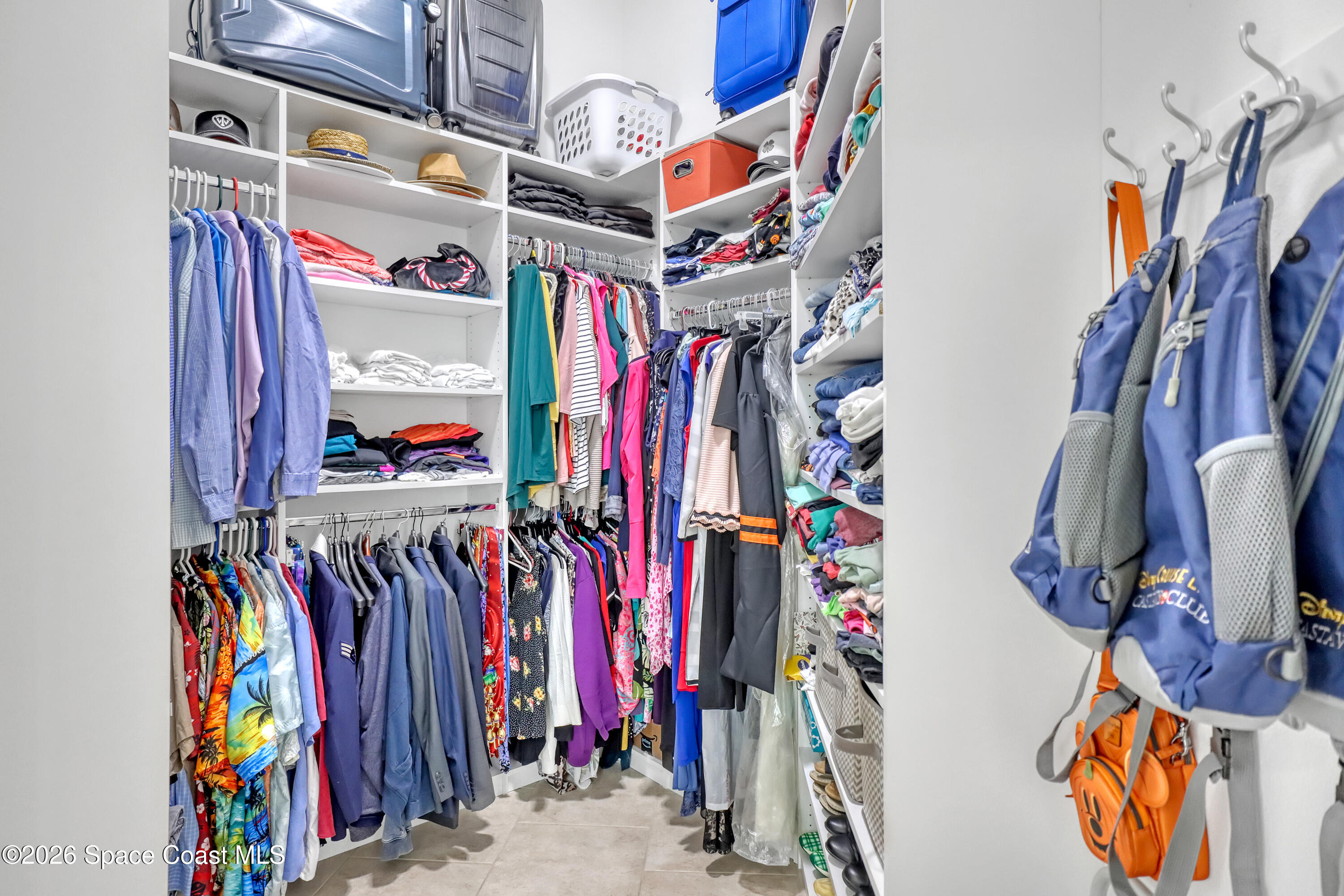 3120 Forest Creek Drive Melbourne, FL 32901 - Photo 26 of 59 a view of walk in closet with clothes