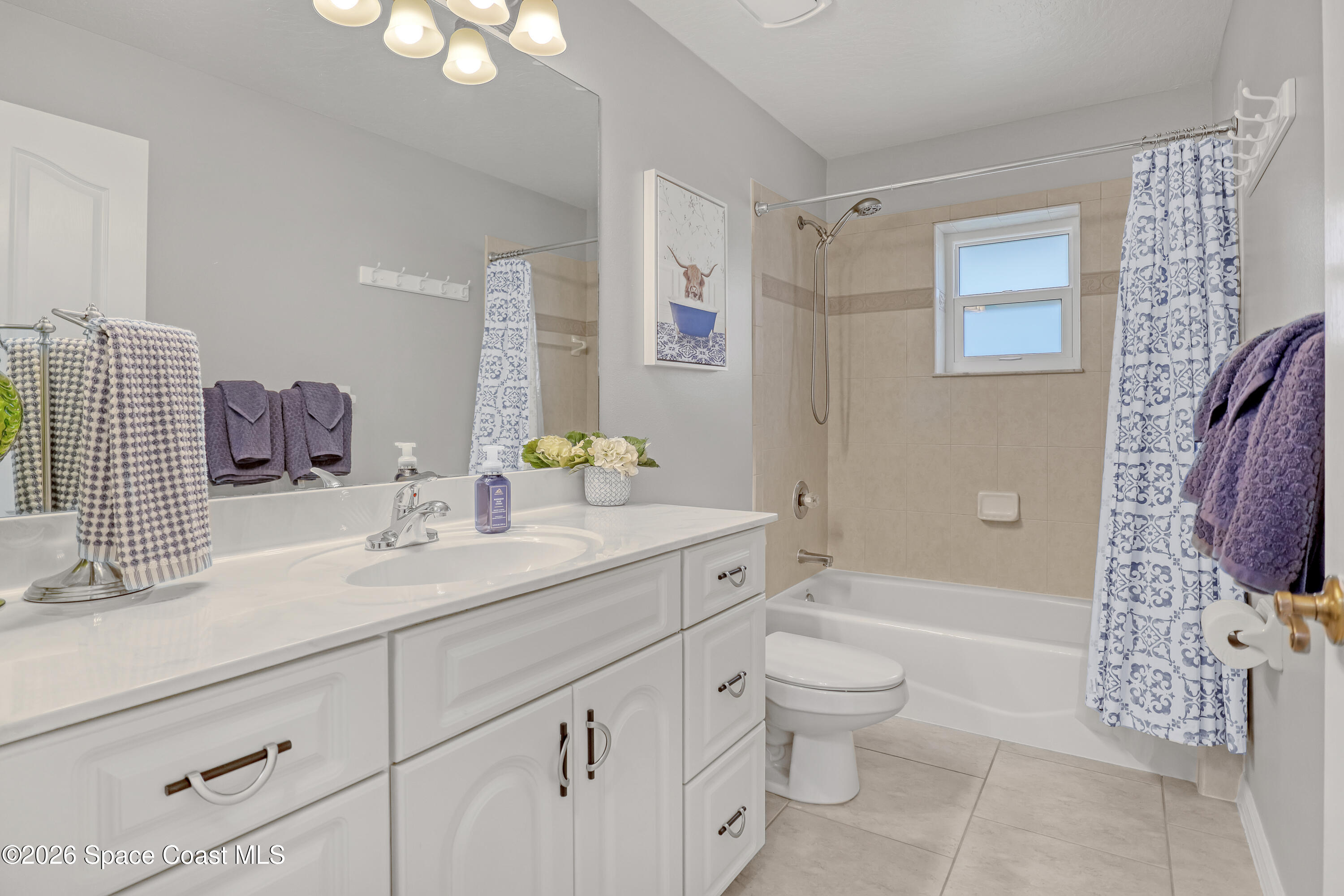 3120 Forest Creek Drive Melbourne, FL 32901 - Photo 33 of 59 a bathroom with a sink a toilet and shower