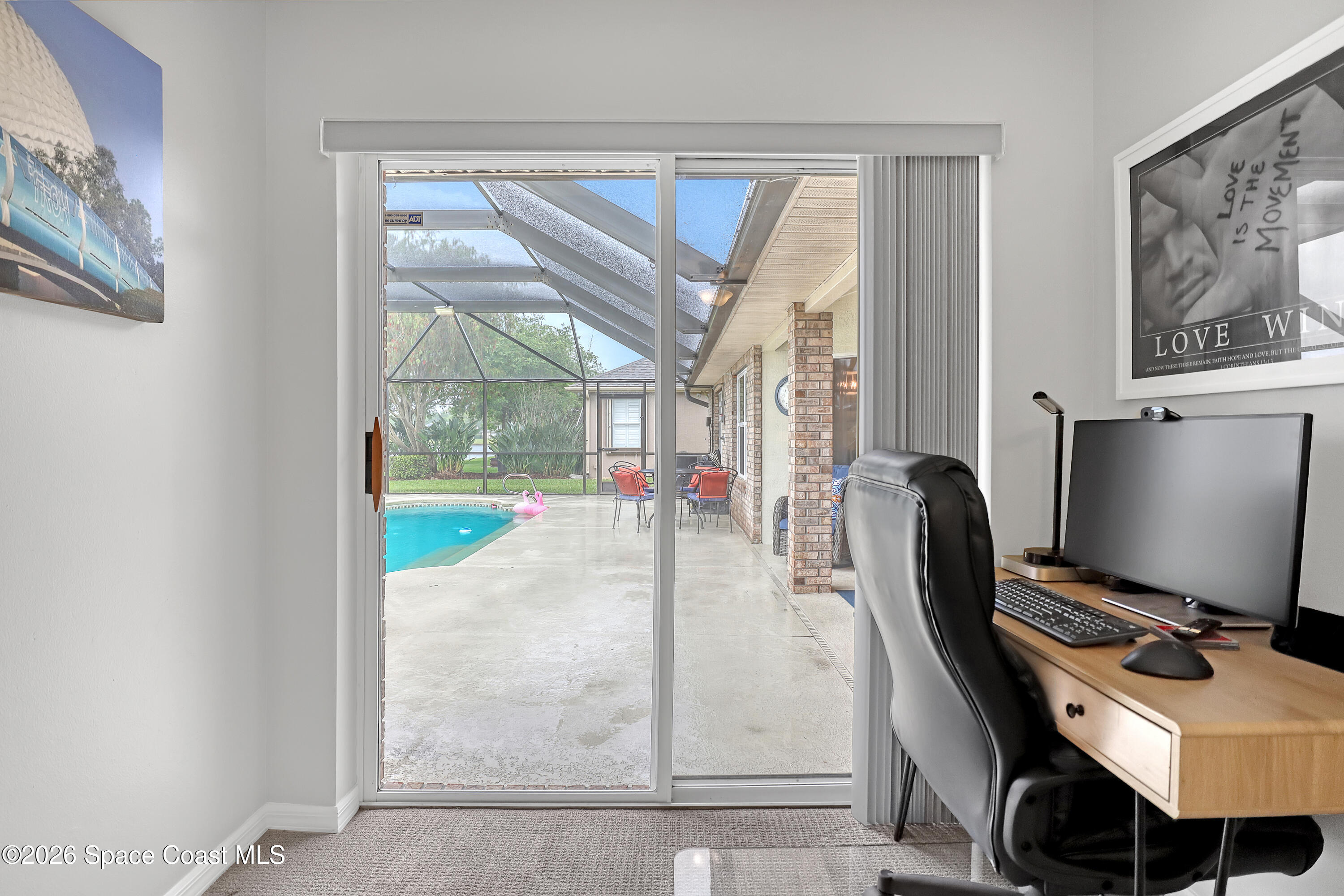3120 Forest Creek Drive Melbourne, FL 32901 - Photo 38 of 59 a view of a workspace with furniture and a window