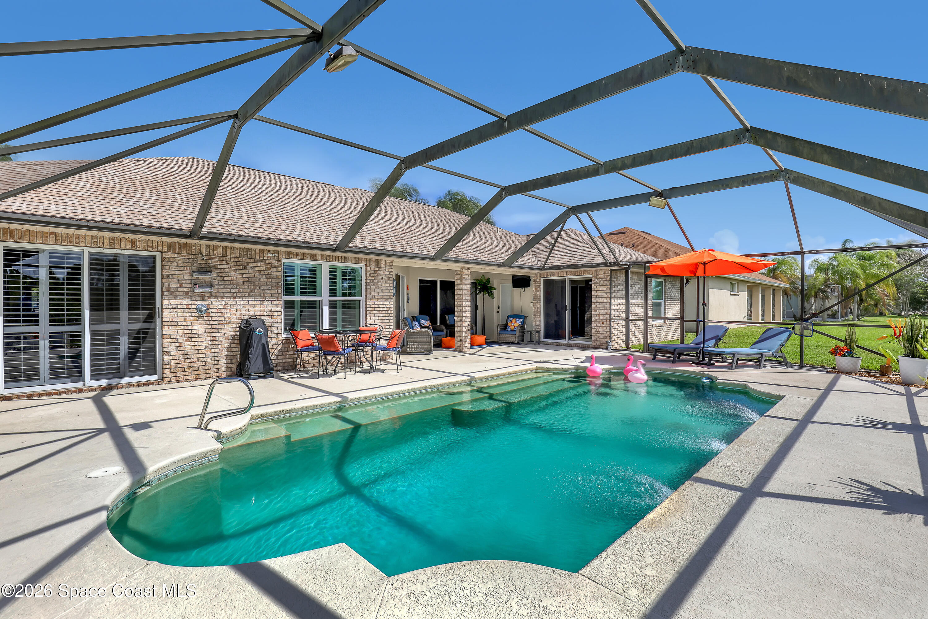 3120 Forest Creek Drive Melbourne, FL 32901 - Photo 44 of 59 a house view with a sitting space and garden