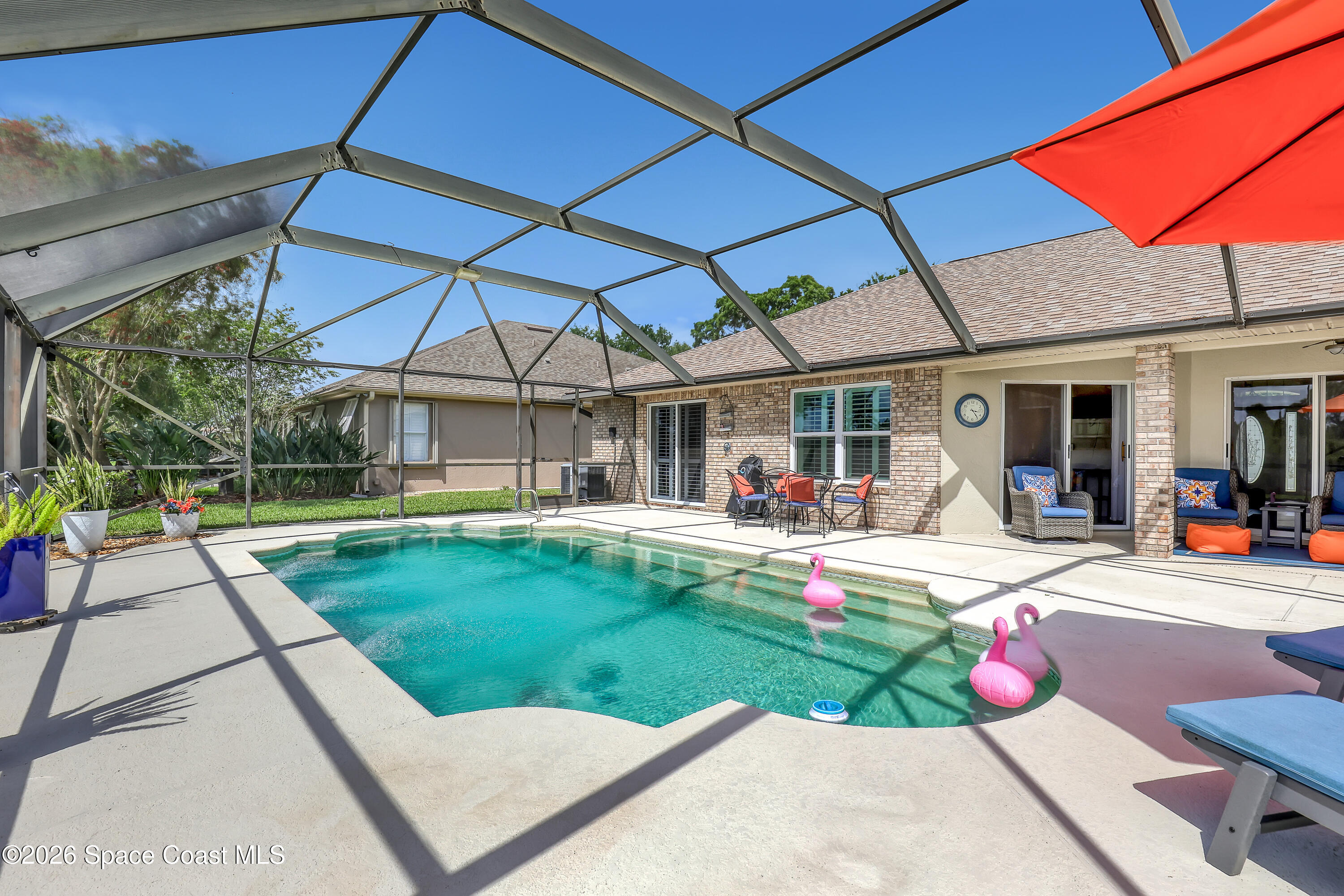 3120 Forest Creek Drive Melbourne, FL 32901 - Photo 45 of 59 a view of a swimming pool with a patio