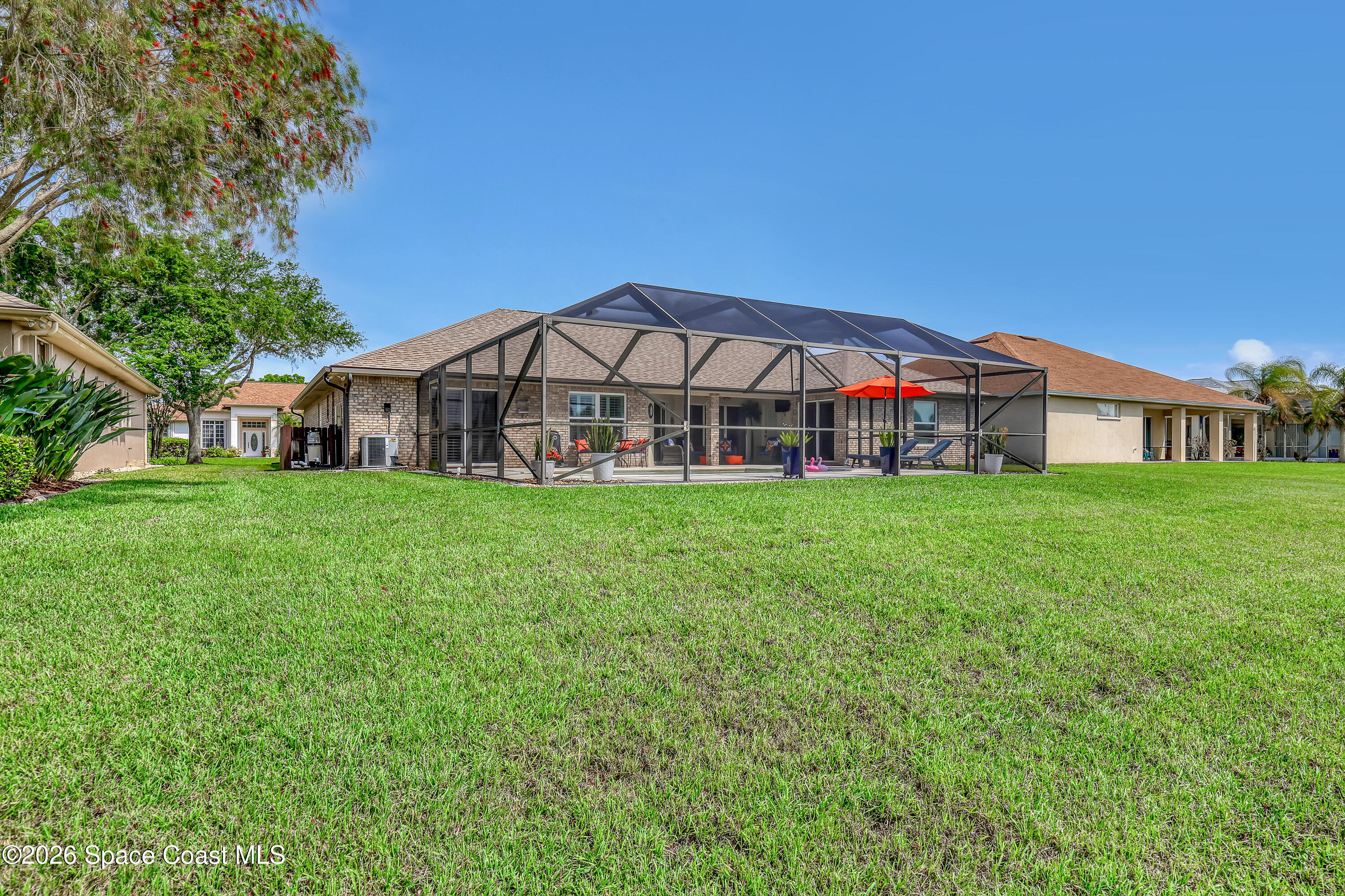 3120 Forest Creek Drive Melbourne, FL 32901 - Photo 47 of 59 a view of a house with a yard and porch