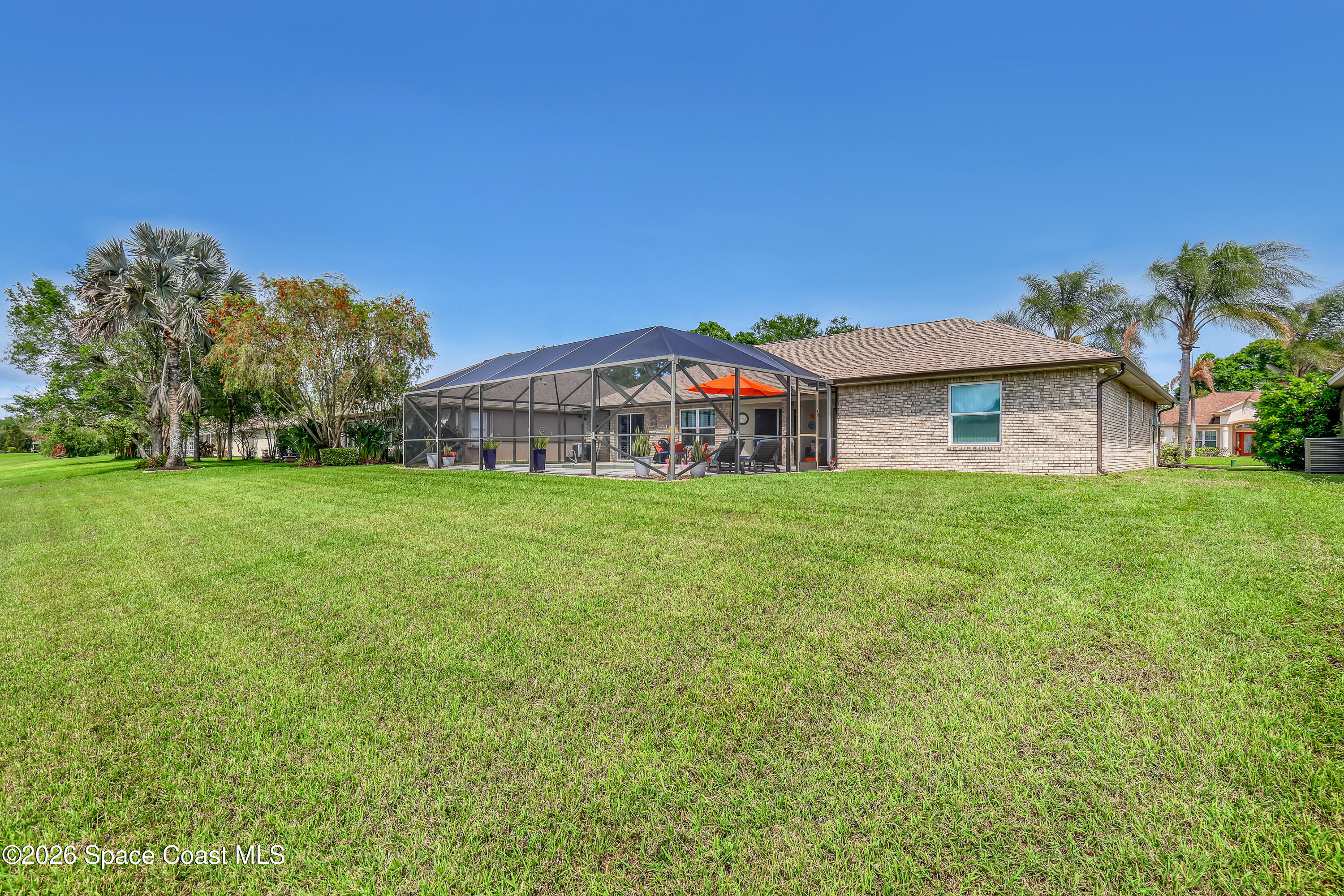 3120 Forest Creek Drive Melbourne, FL 32901 - Photo 49 of 59 a view of a house with a big yard