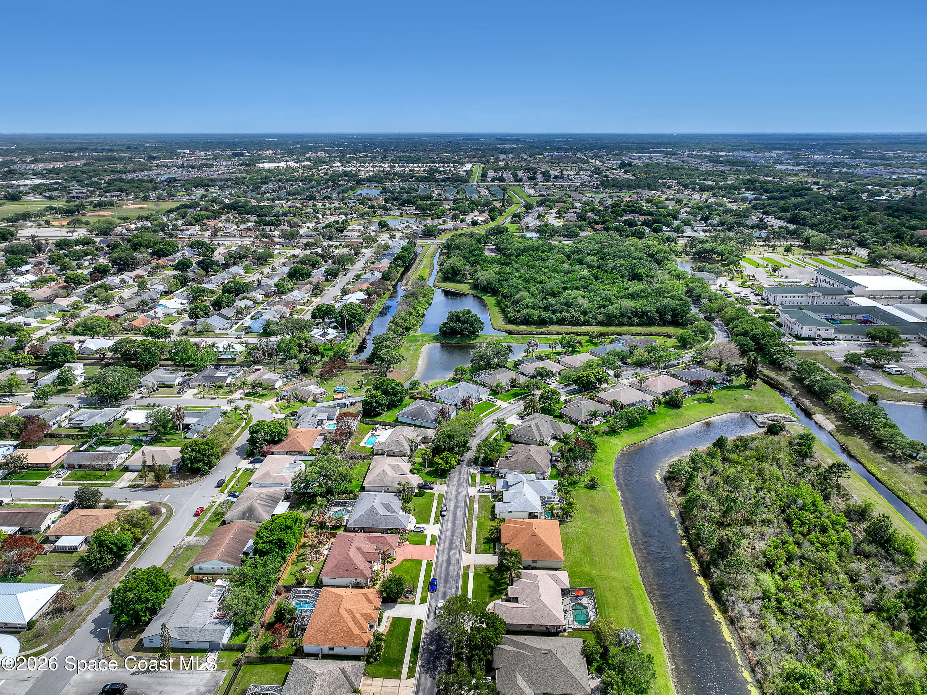 3120 Forest Creek Drive Melbourne, FL 32901 - Photo 54 of 59 an aerial view of residential houses with outdoor space