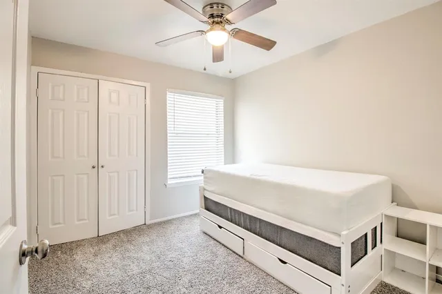 a room with a bed and a chandelier