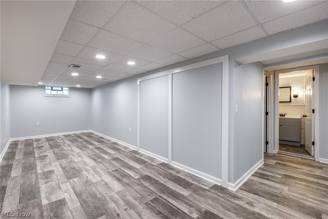 29220 Ridge Road Wickliffe, OH 44092 - Photo 28 of 34 Basement with hardwood / wood-style flooring and a drop ceiling