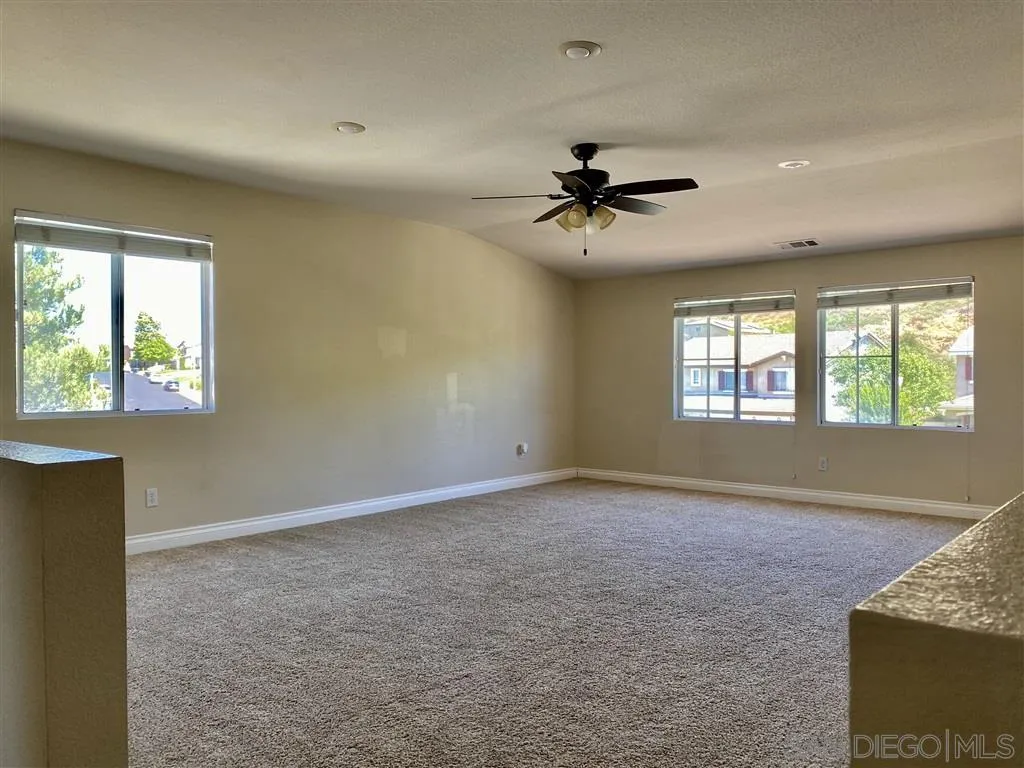 33734 Abbey Road Temecula, CA 92592 - Photo 6 of 25 a view of an empty room with a window