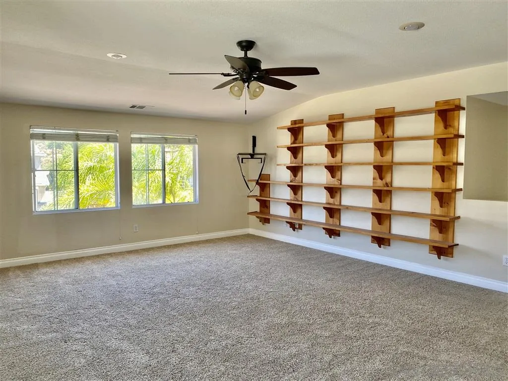 33734 Abbey Road Temecula, CA 92592 - Photo 7 of 25 wooden floor in an empty room with a window