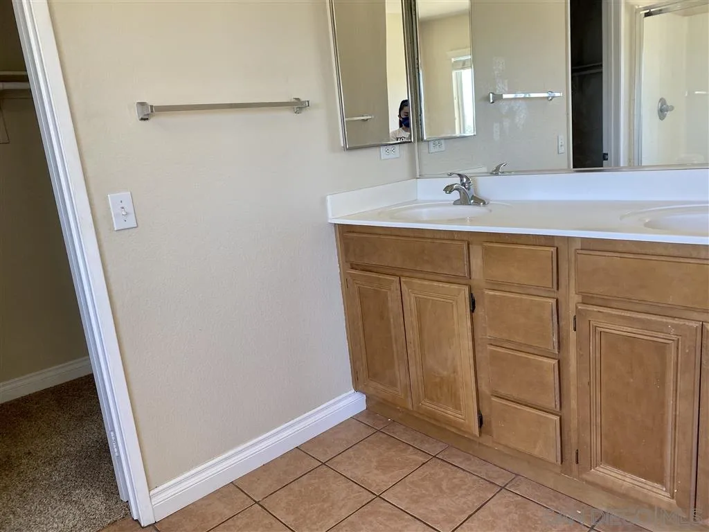 33734 Abbey Road Temecula, CA 92592 - Photo 9 of 25 a bathroom with a sink and a mirror