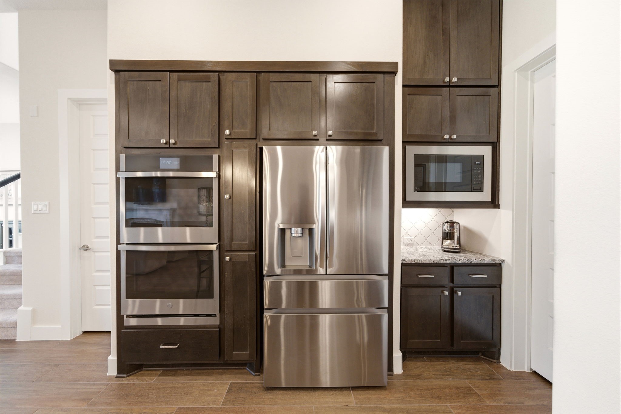 28811 Ember Crest Lane Fulshear, TX 77441 - Photo 14 of 47 a kitchen with cabinets and stainless steel appliances